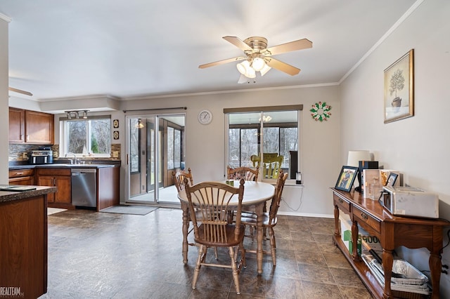 dining room with ceiling fan, crown molding, and a wealth of natural light