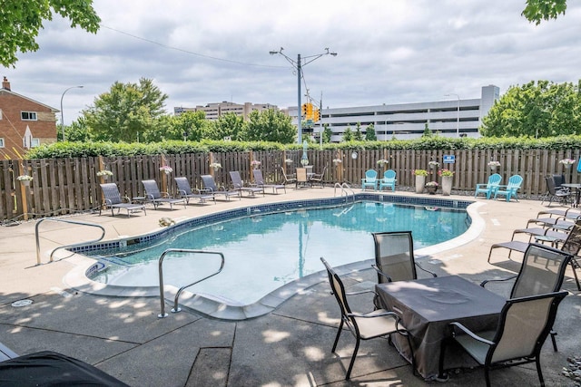 view of pool featuring a patio