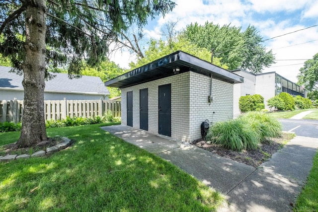 view of outdoor structure with a lawn