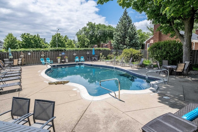 view of swimming pool featuring a patio area