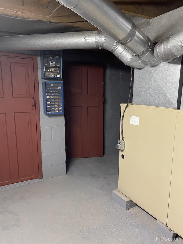 basement featuring heating unit