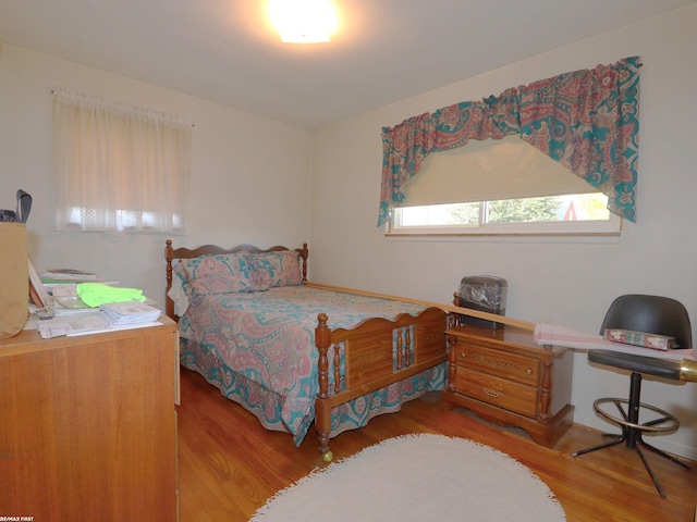 bedroom with light hardwood / wood-style flooring