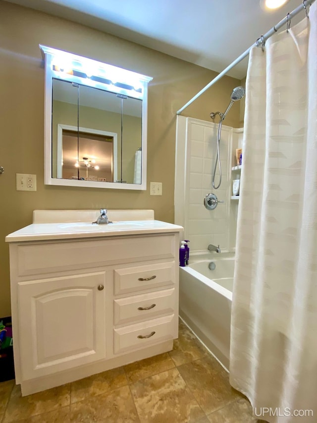 bathroom featuring vanity and shower / tub combo