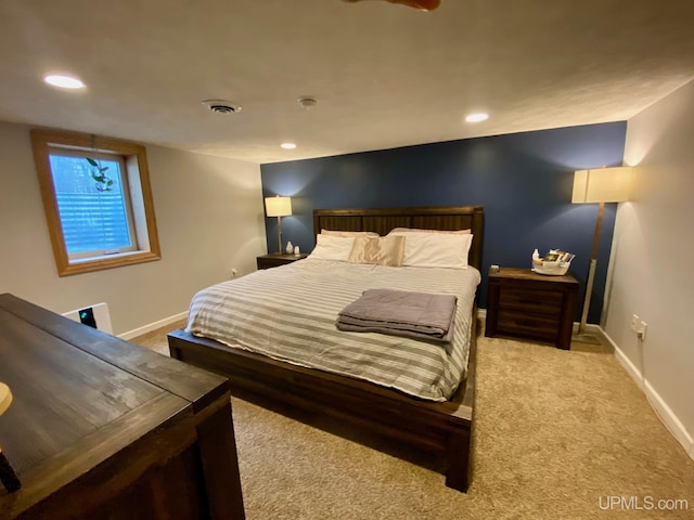 bedroom featuring light colored carpet