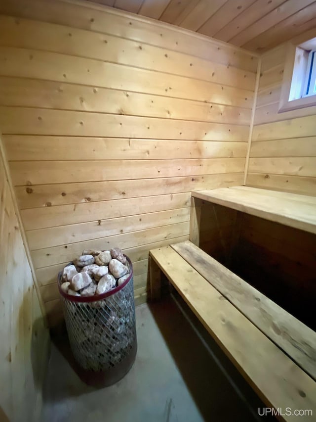 view of sauna featuring concrete floors