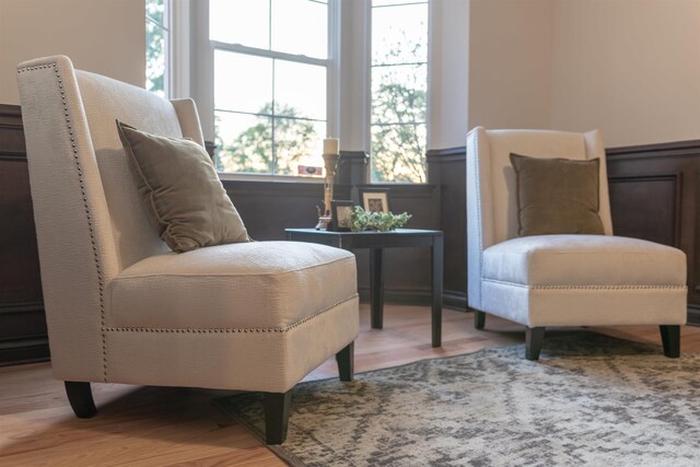 sitting room with wood-type flooring