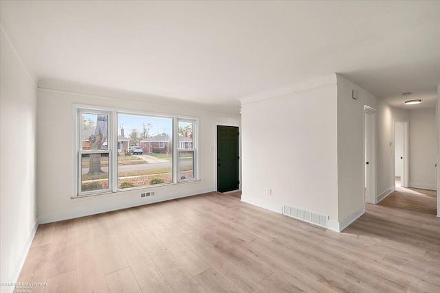 unfurnished room with light hardwood / wood-style floors