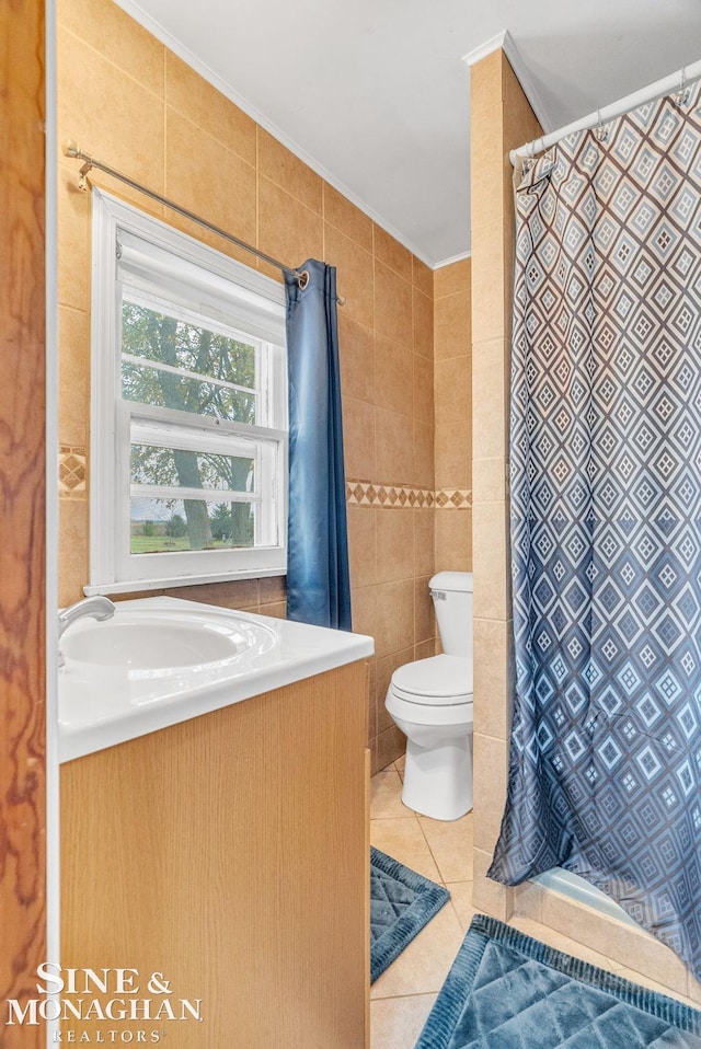 bathroom with tile patterned flooring, toilet, tile walls, and a shower with shower curtain