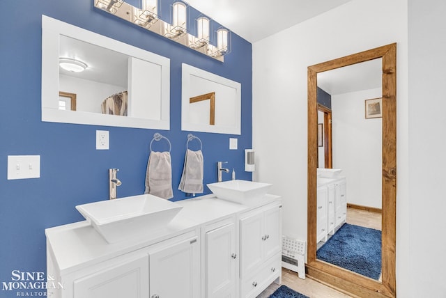 bathroom with tile patterned floors and vanity