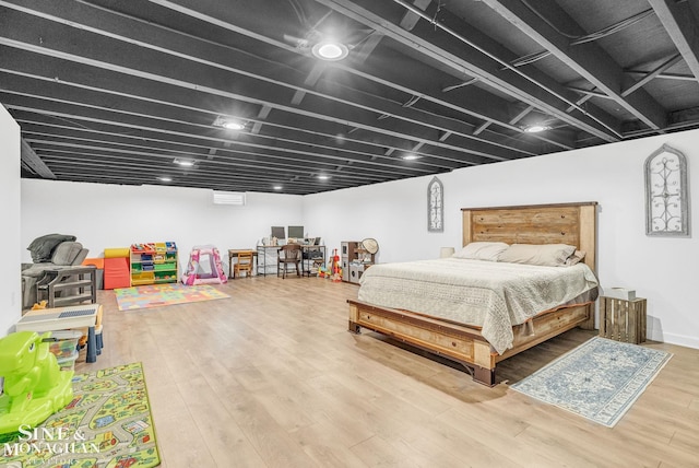 bedroom with hardwood / wood-style floors