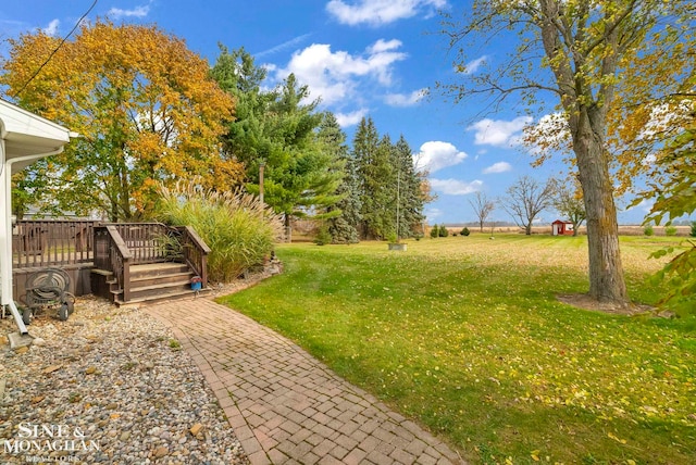 view of yard featuring a wooden deck