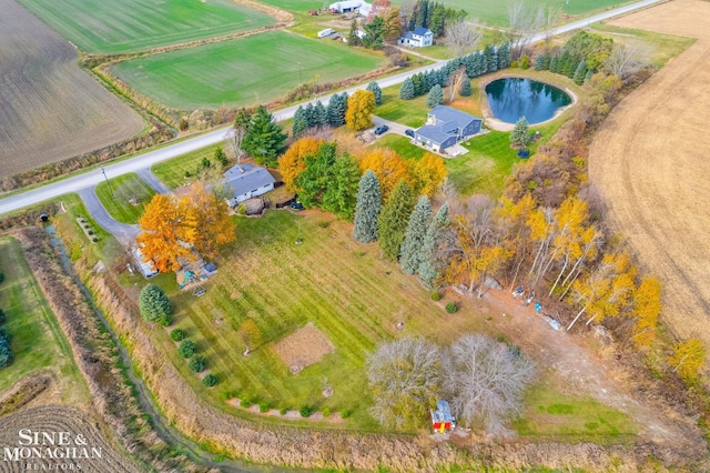 drone / aerial view featuring a rural view and a water view