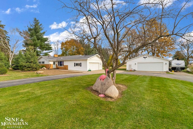 view of front of home with a front lawn and a garage