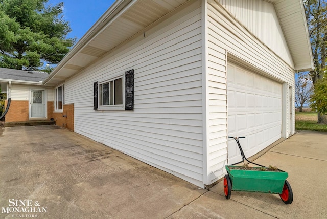 view of property exterior with a garage