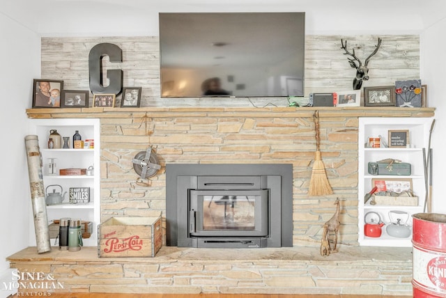 interior details featuring a wood stove