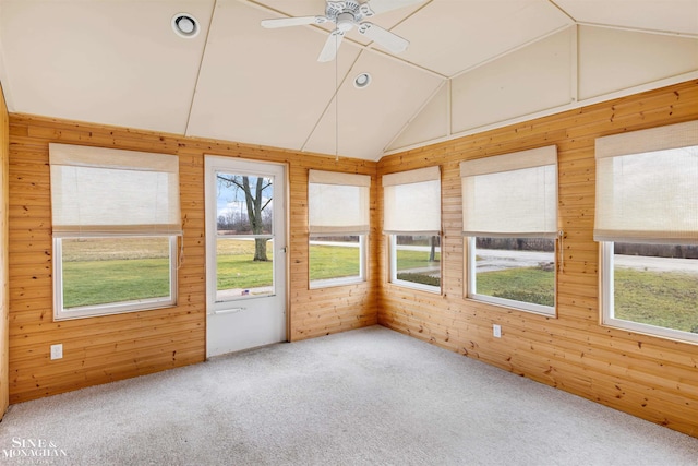 unfurnished sunroom featuring ceiling fan and lofted ceiling