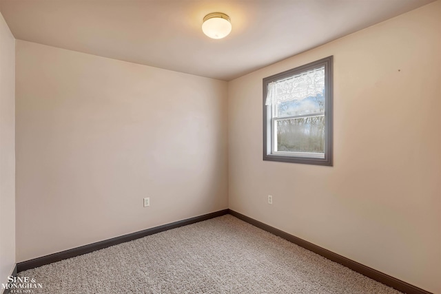 empty room with carpet flooring