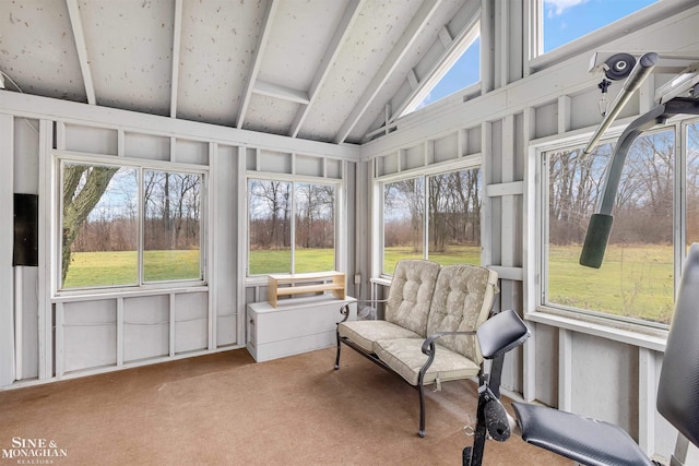 sunroom with a wealth of natural light and lofted ceiling