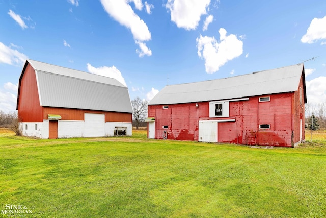 exterior space with an outbuilding and a lawn