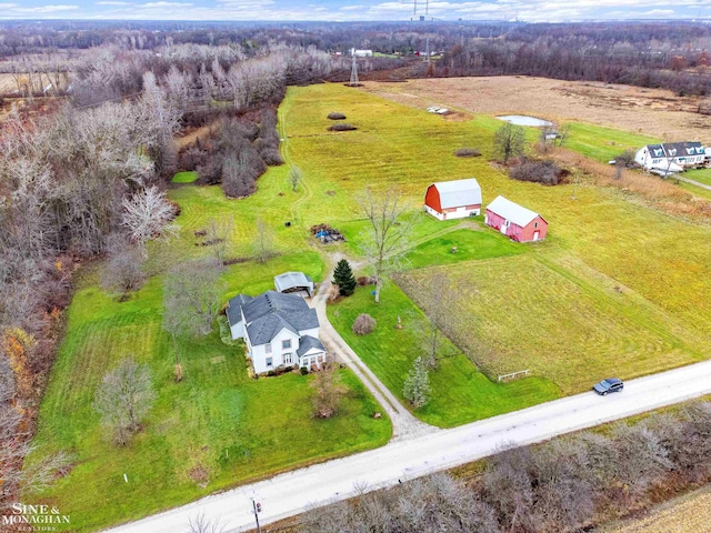 birds eye view of property with a rural view