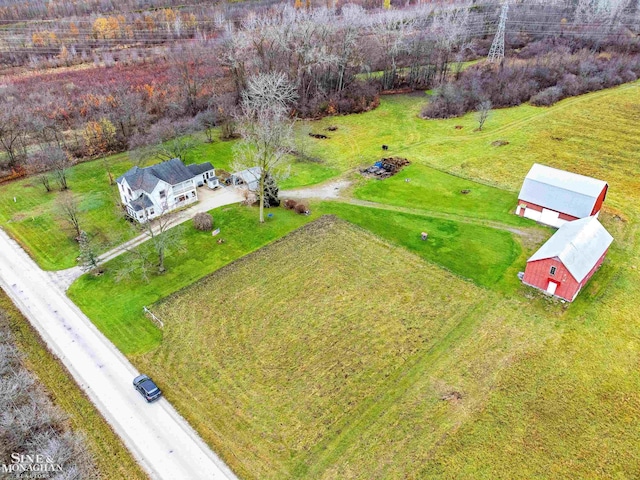 birds eye view of property with a rural view