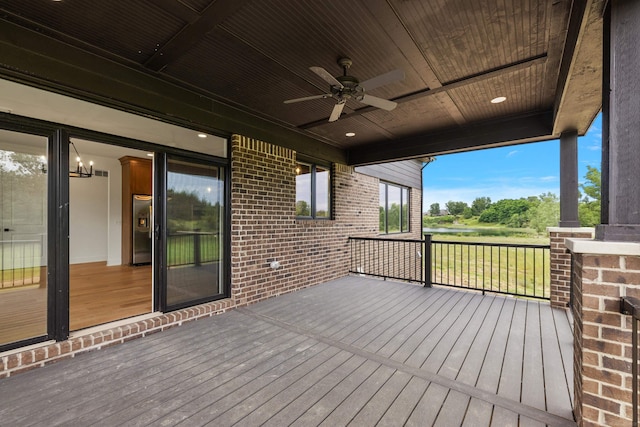 wooden terrace featuring ceiling fan