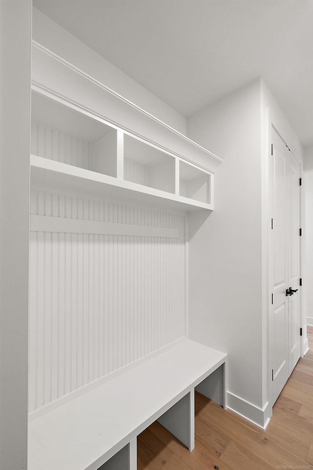 mudroom with wood-type flooring