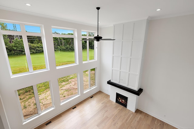 sunroom / solarium featuring ceiling fan