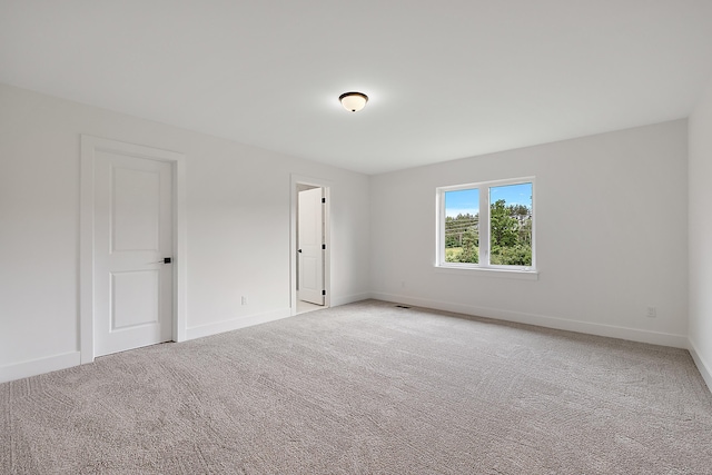 unfurnished room with carpet