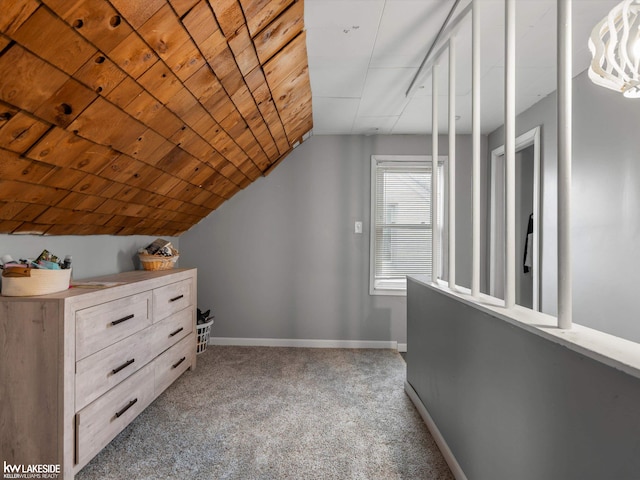 bonus room with lofted ceiling, light colored carpet, and wooden ceiling