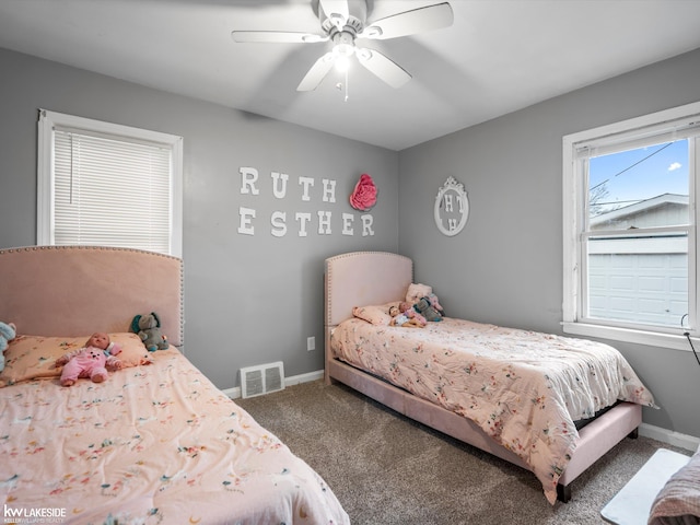 bedroom with ceiling fan and carpet floors