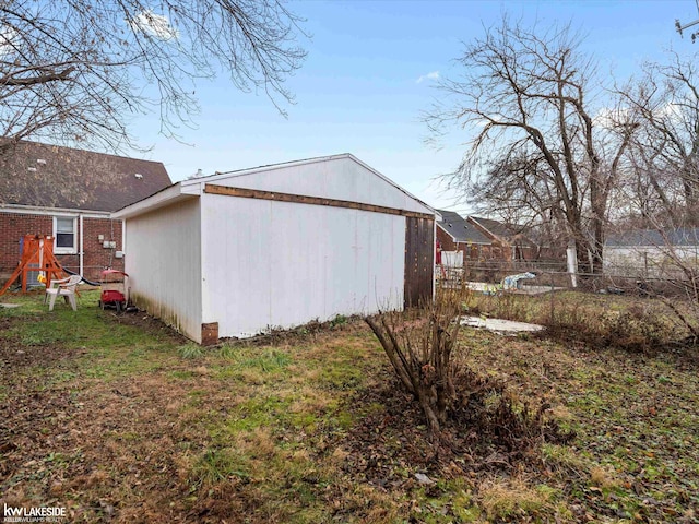 view of side of property featuring an outbuilding