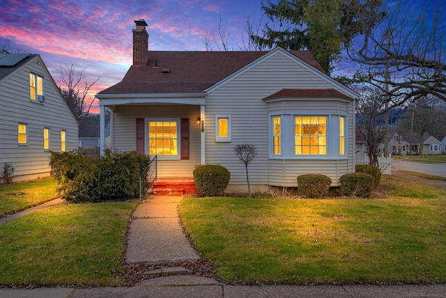 view of front of property with a yard