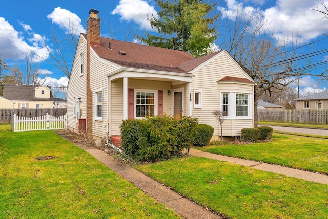 bungalow-style home featuring a front lawn