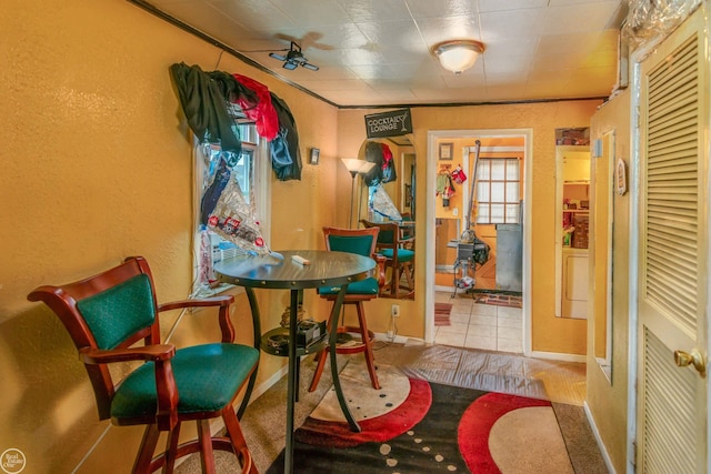 dining room featuring ceiling fan and light tile patterned flooring