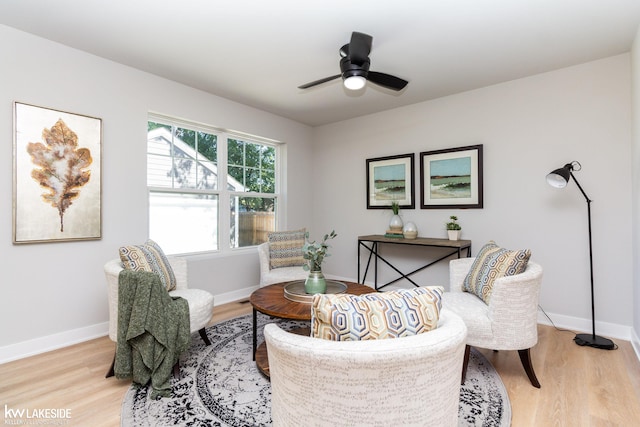 sitting room featuring ceiling fan and light wood-type flooring