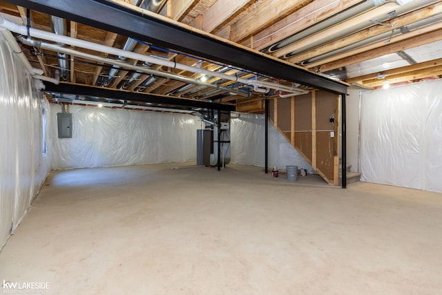 basement with heating unit and electric panel