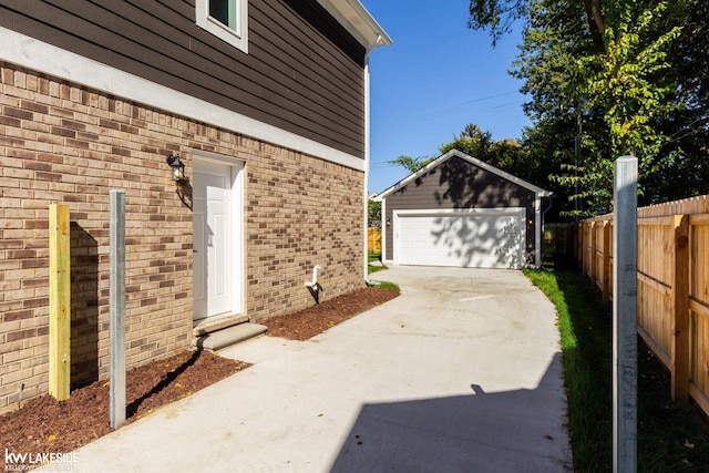 exterior space with an outbuilding and a garage