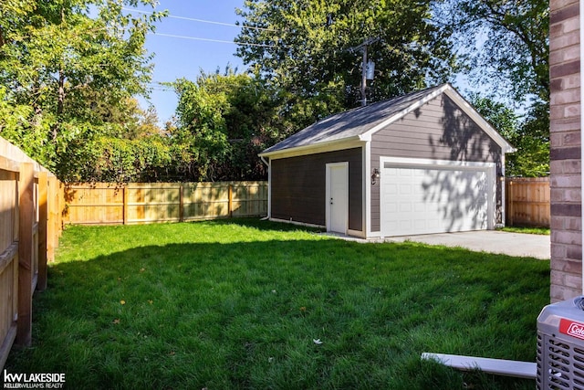 garage featuring a lawn