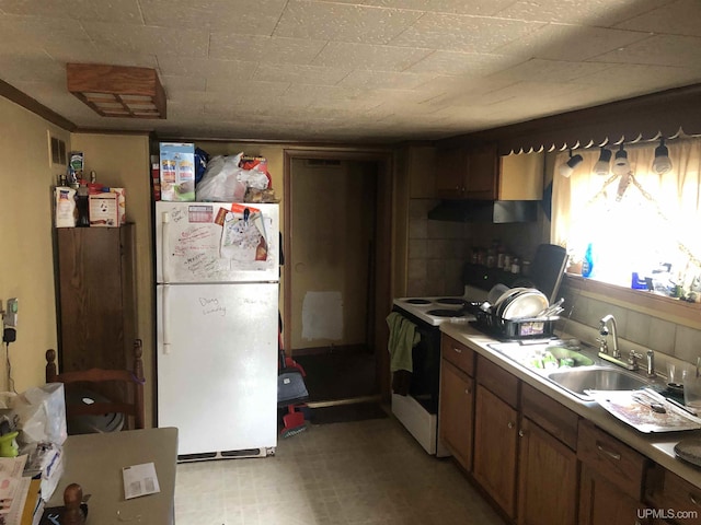 kitchen with white appliances and sink