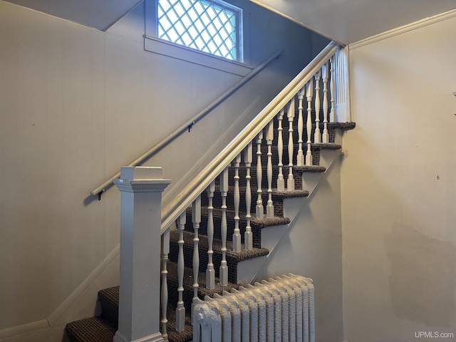 stairs featuring radiator heating unit