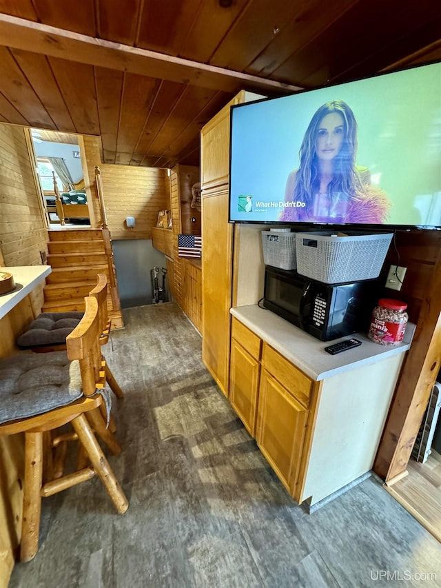 interior space with wooden ceiling and wooden walls