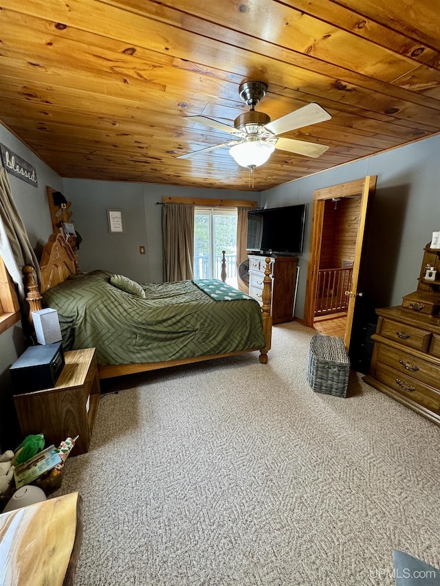 carpeted bedroom featuring ceiling fan, wood ceiling, and vaulted ceiling