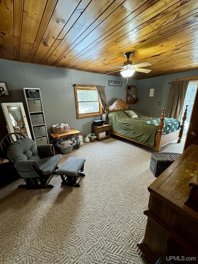 bedroom with carpet, ceiling fan, wooden ceiling, and multiple windows