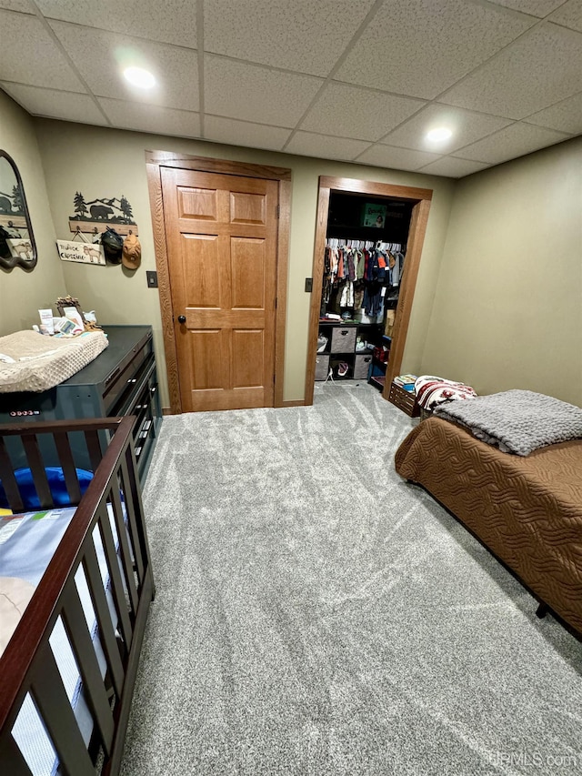 carpeted bedroom with a closet