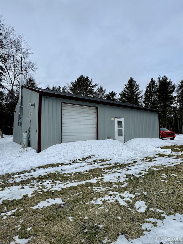 view of snow covered garage