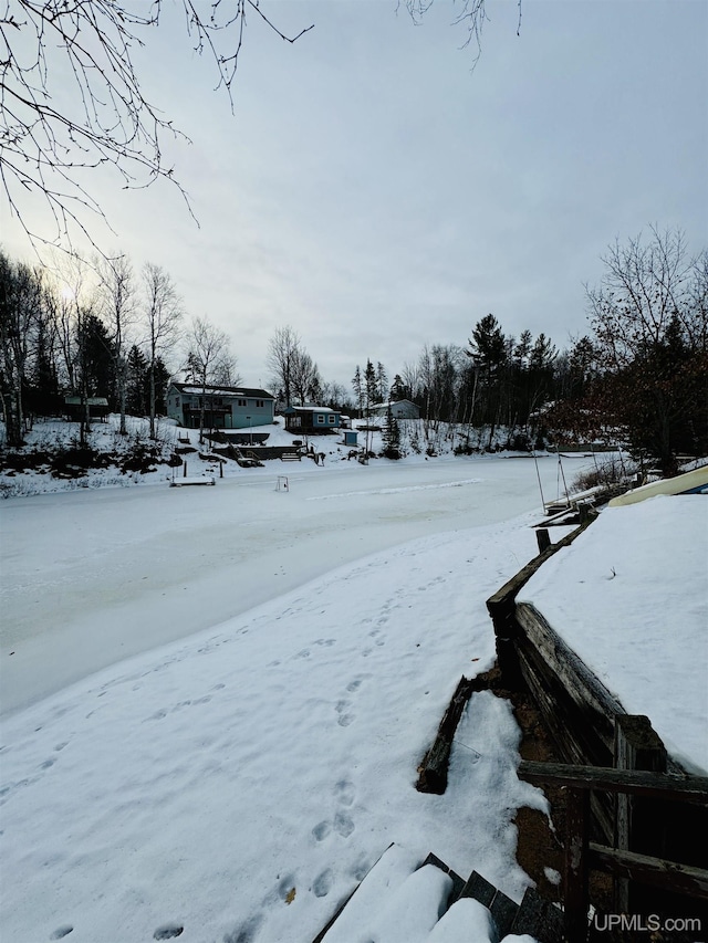 view of yard covered in snow