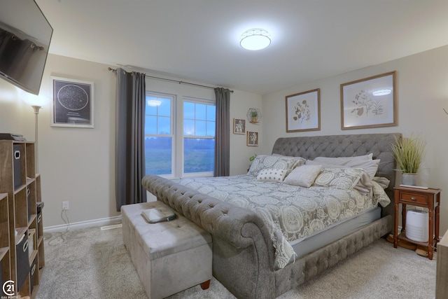 bedroom with light colored carpet