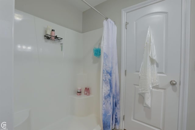 bathroom with a shower with shower curtain