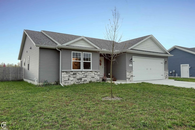 ranch-style house featuring a garage and a front yard